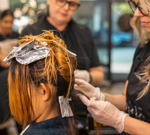Demi International student learning to colour hair with foils